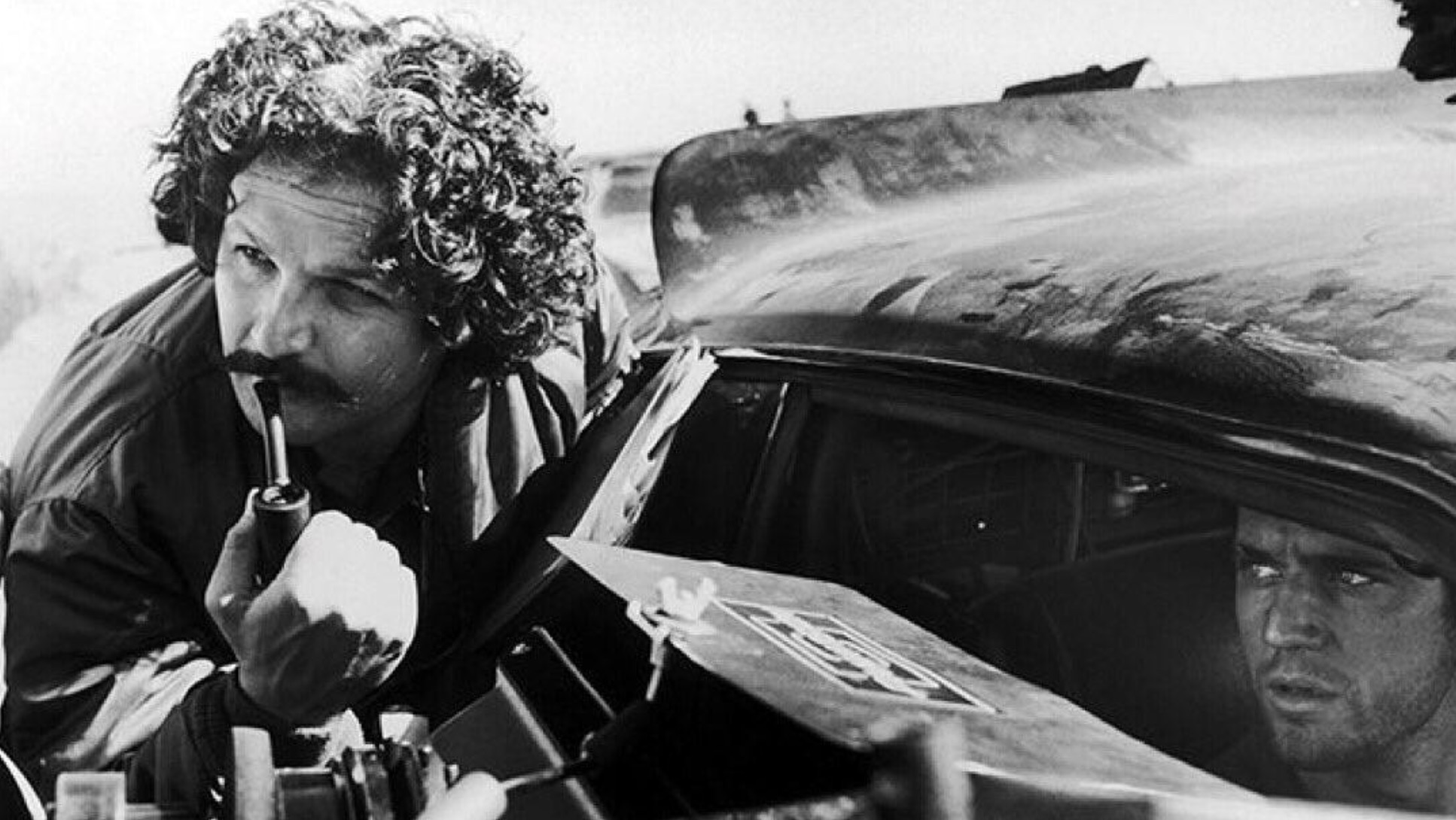 Director George Miller with Mel Gibson on the set of “Mad Max 2: The Road Warrior”, 1981 